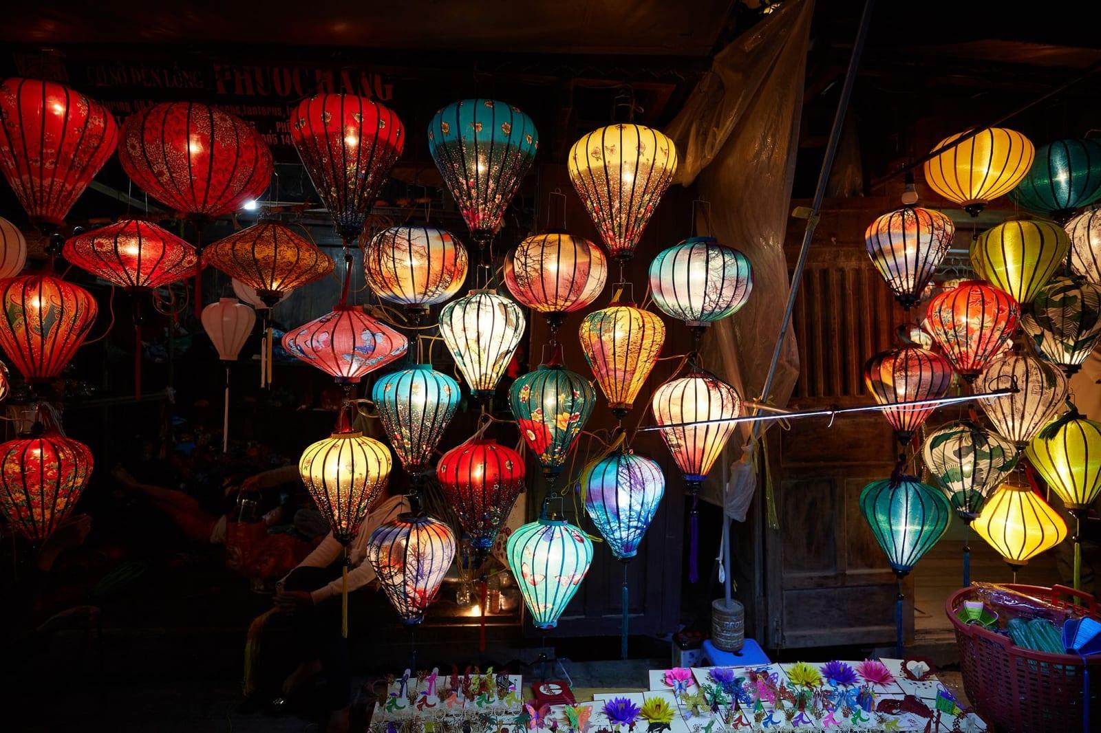 Lanterns reflected on the river in Hoi An old town at dusk