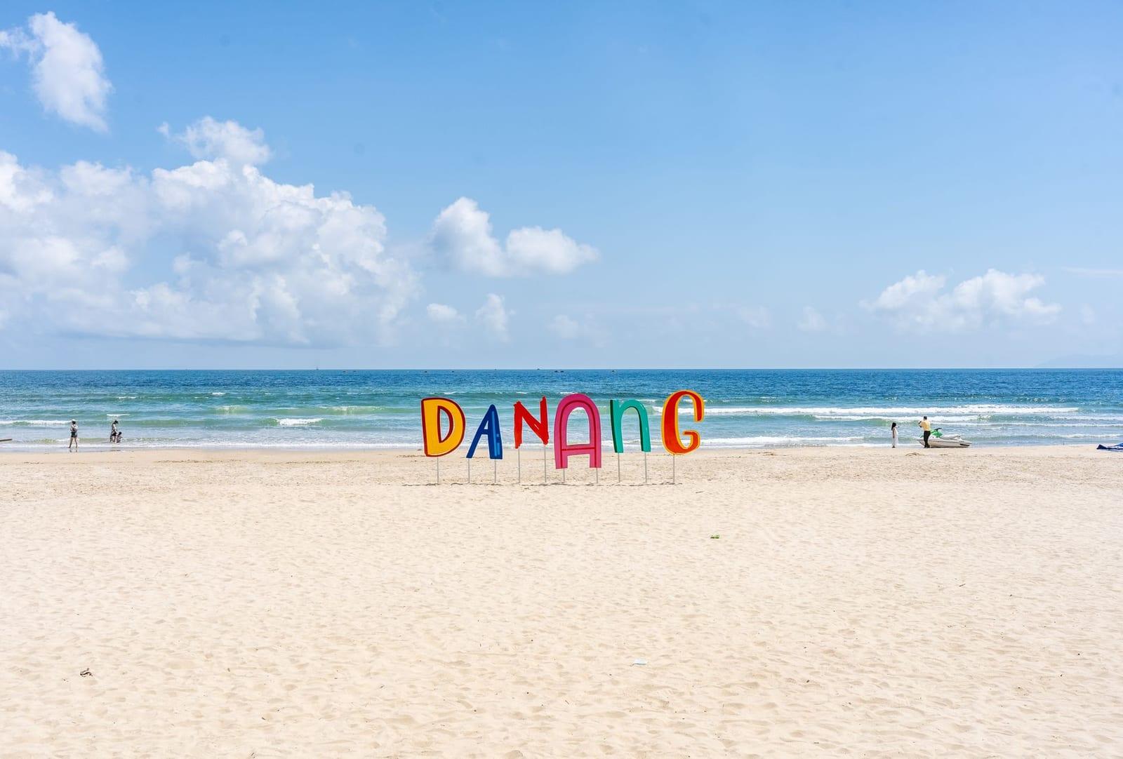 Early morning on My Khe Beach in Da Nang, calm water and quiet sand