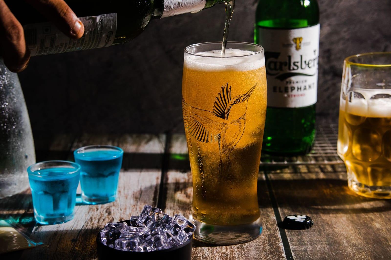 A glass of Vietnamese beer poured over ice, the local way to drink it.
